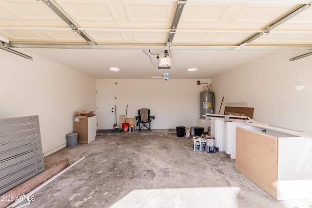 garage featuring electric water heater and a garage door opener