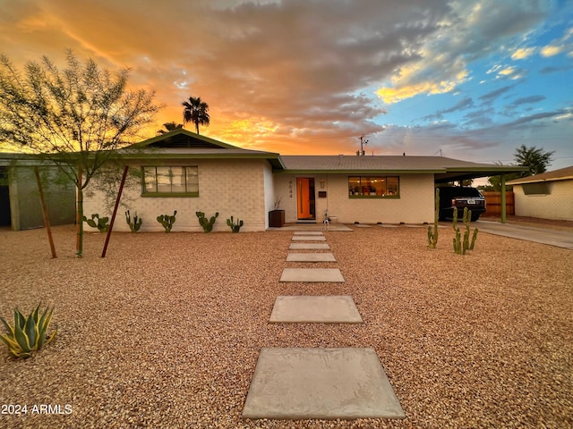 view of front of property featuring a carport