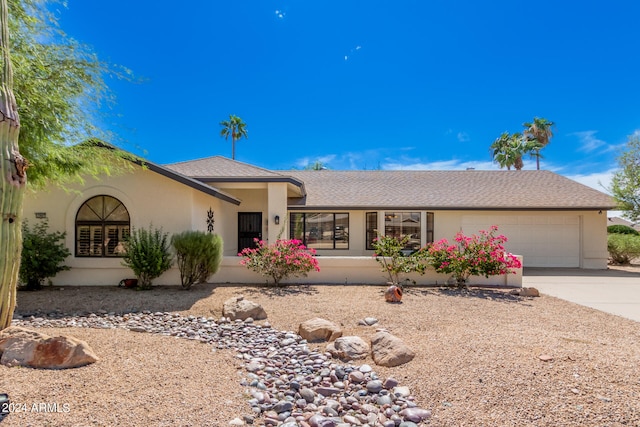 ranch-style house featuring a garage