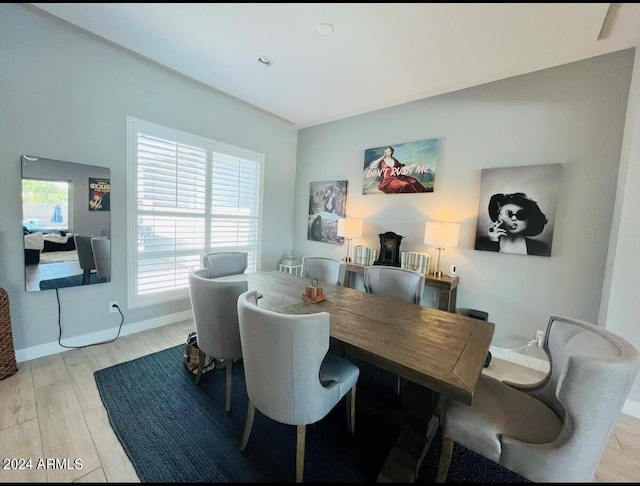 dining space featuring light wood-type flooring