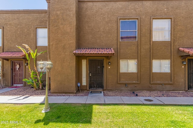 16225 N 30th St Unit 11, Phoenix, AZ 85032 - multi unit property with a tile roof, stucco siding, and a front yard