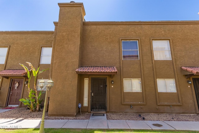 16225 N 30th St Unit 11, Phoenix, AZ 85032 - view of front of property featuring a tile roof and stucco siding