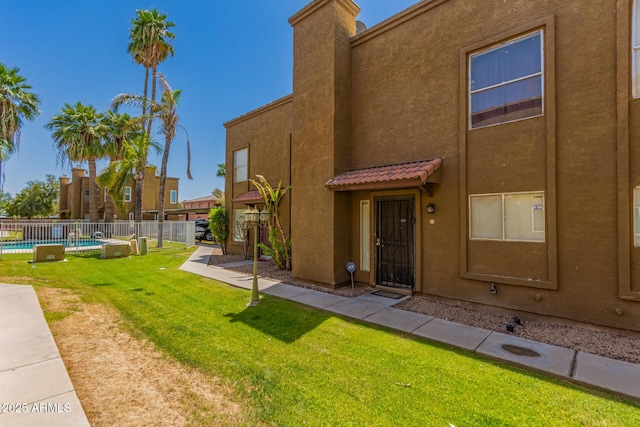 16225 N 30th St Unit 11, Phoenix, AZ 85032 - back of house featuring stucco siding and a tile roof