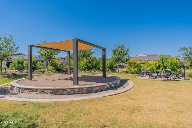 view of yard featuring an outdoor fire pit