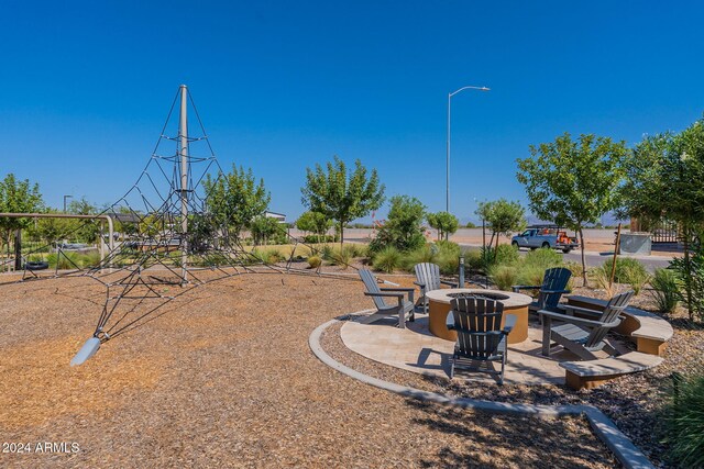 view of yard with an outdoor fire pit and a patio area