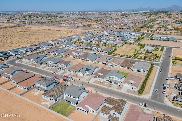 birds eye view of property featuring a mountain view