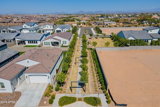 birds eye view of property with a mountain view