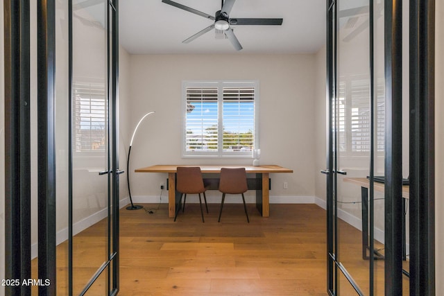 office area with ceiling fan and light hardwood / wood-style flooring