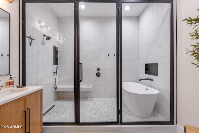 bathroom featuring vanity and plus walk in shower