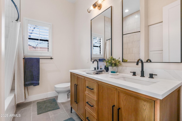 bathroom featuring tile patterned floors, toilet, and vanity