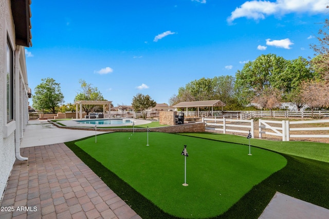 exterior space with a gazebo and a swimming pool