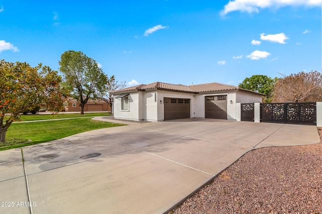 view of front of property featuring a garage and a front yard