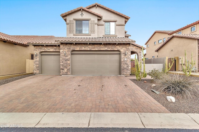 mediterranean / spanish-style home with a garage