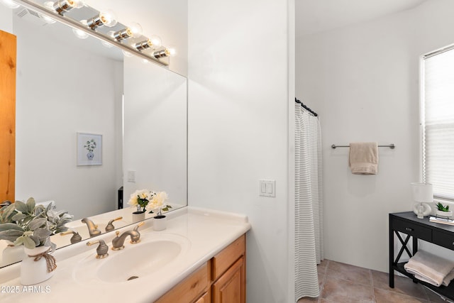 full bath with vanity and tile patterned flooring