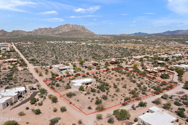 drone / aerial view with a mountain view and a desert view