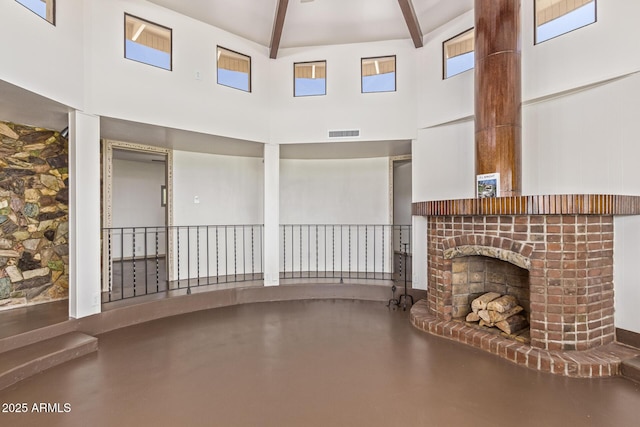 1545 E Christy Dr, Phoenix, AZ 85020 - unfurnished living room with a high ceiling, finished concrete floors, a brick fireplace, and beamed ceiling