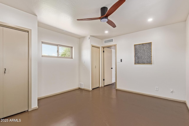 1545 E Christy Dr, Phoenix, AZ 85020 - unfurnished bedroom with concrete floors, recessed lighting, baseboards, and a ceiling fan