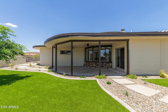 1545 E Christy Dr, Phoenix, AZ 85020 - rear view of house with a patio, a lawn, and a ceiling fan