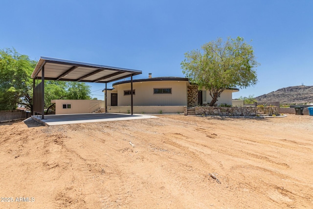 1545 E Christy Dr, Phoenix, AZ 85020 - rear view of property featuring a carport, a mountain view, and driveway