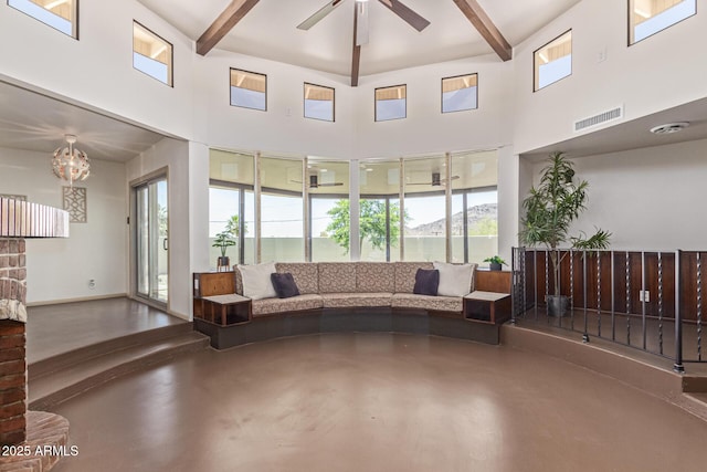 1545 E Christy Dr, Phoenix, AZ 85020 - living area with beamed ceiling, concrete flooring, a high ceiling, and a ceiling fan