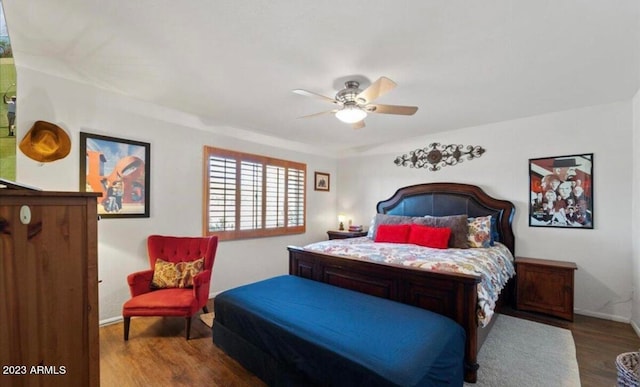 bedroom with wood-type flooring and ceiling fan