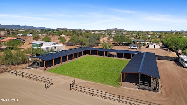 birds eye view of property with a mountain view