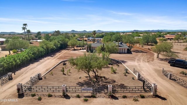 birds eye view of property featuring a mountain view