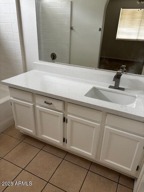 bathroom featuring tile patterned flooring and vanity