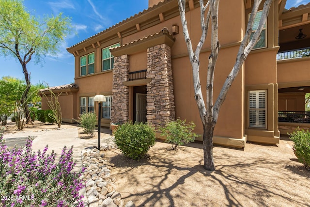 19700 N 76th St Unit 1040, Scottsdale, AZ 85255 - back of house featuring stucco siding and a tiled roof