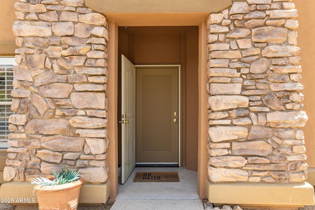 19700 N 76th St Unit 1040, Scottsdale, AZ 85255 - view of exterior entry featuring stone siding