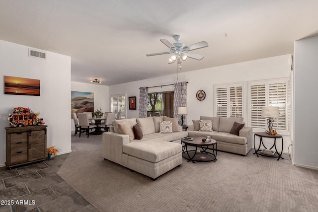 19700 N 76th St Unit 1040, Scottsdale, AZ 85255 - living area with a ceiling fan and baseboards