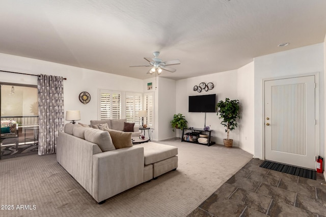 19700 N 76th St Unit 1040, Scottsdale, AZ 85255 - carpeted living area featuring ceiling fan and stone finish flooring