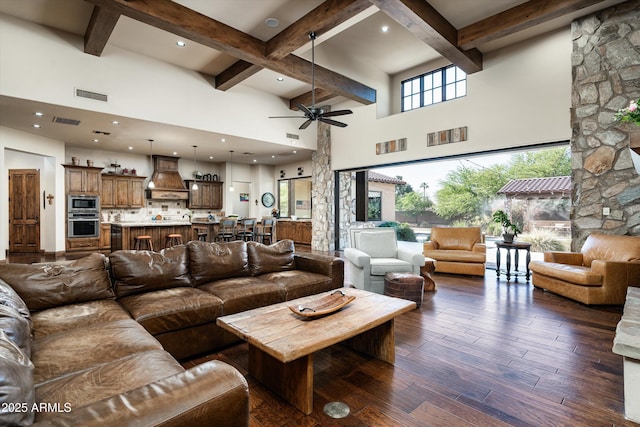 4610 E Meadowview Dr, Gilbert, AZ 85298 - living room featuring beam ceiling, dark wood finished floors, ceiling fan, a high ceiling, and recessed lighting