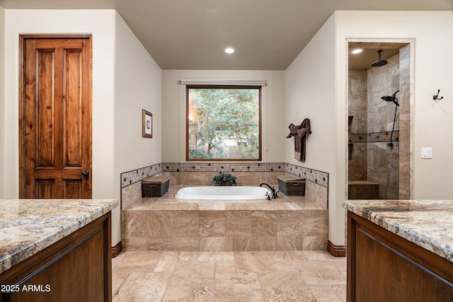 4610 E Meadowview Dr, Gilbert, AZ 85298 - bathroom featuring a bath, tiled shower, vanity, recessed lighting, and stone tile floors