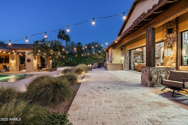 4610 E Meadowview Dr, Gilbert, AZ 85298 - patio at twilight with a patio and an outdoor pool