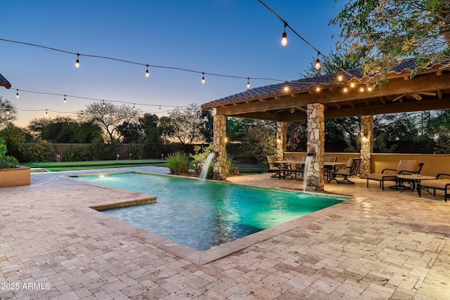 4610 E Meadowview Dr, Gilbert, AZ 85298 - pool at dusk with a gazebo and a patio area