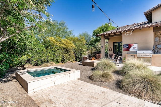 4610 E Meadowview Dr, Gilbert, AZ 85298 - view of patio with an in-ground hot tub and an outdoor fire pit