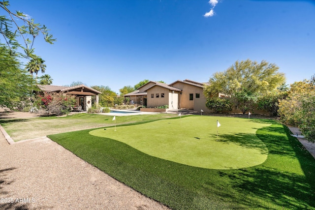 4610 E Meadowview Dr, Gilbert, AZ 85298 - view of yard featuring a putting area and a patio area