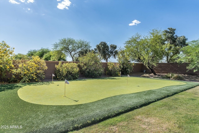 4610 E Meadowview Dr, Gilbert, AZ 85298 - surrounding community with a putting green and a fenced backyard