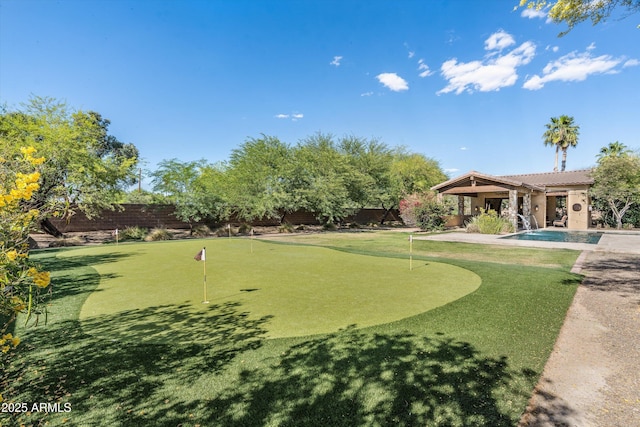 4610 E Meadowview Dr, Gilbert, AZ 85298 - view of property's community with a putting green, a fenced backyard, and a swimming pool