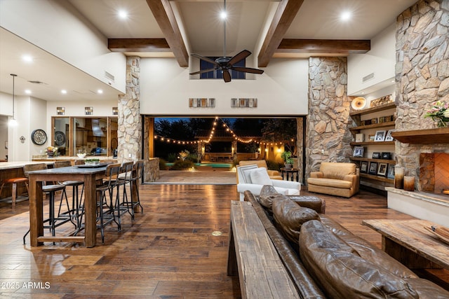 4610 E Meadowview Dr, Gilbert, AZ 85298 - living room featuring a fireplace, beam ceiling, ceiling fan, wood-type flooring, and recessed lighting