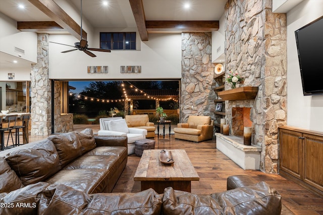 4610 E Meadowview Dr, Gilbert, AZ 85298 - living area featuring beamed ceiling, wood finished floors, a fireplace, and a ceiling fan
