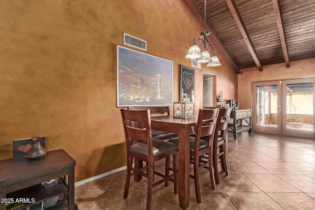 dining room with beam ceiling, french doors, wooden ceiling, high vaulted ceiling, and a notable chandelier