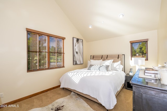 bedroom featuring vaulted ceiling and light colored carpet