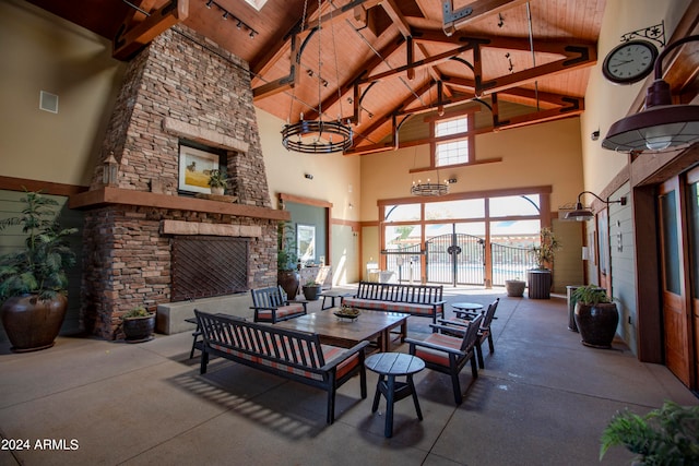 view of patio with an outdoor living space with a fireplace