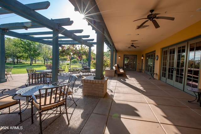 view of patio featuring ceiling fan and a pergola