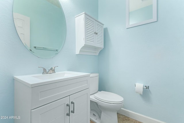 bathroom with tile patterned floors, toilet, and vanity