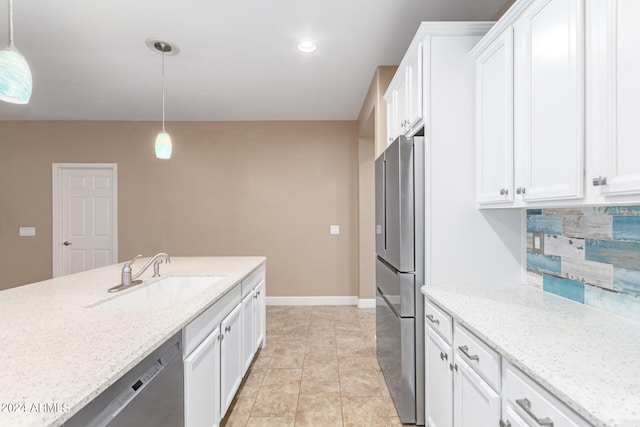 kitchen featuring light tile patterned flooring, sink, appliances with stainless steel finishes, tasteful backsplash, and pendant lighting