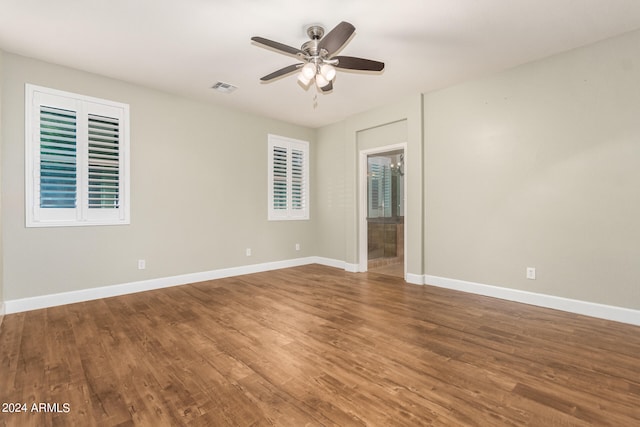 spare room with ceiling fan and hardwood / wood-style floors