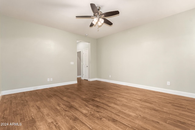 unfurnished room featuring ceiling fan and hardwood / wood-style flooring